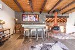 High top bar, wood stove and stunning stained glass window